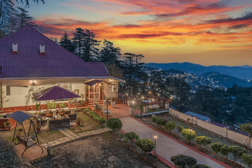 drone capture of a serene lodge exterior in the hill station