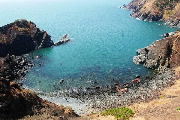 A small beach looked upon from the fort behind it