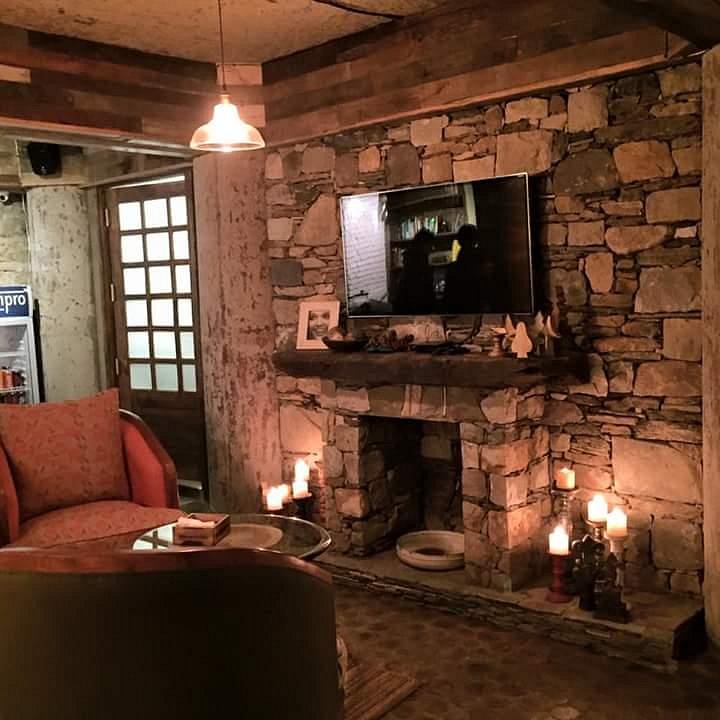 Fireplace inside a cozy warmly lit cafe