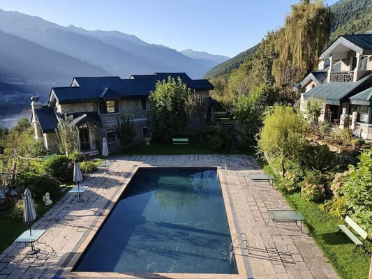 swimming pool view of the himalayan hotel in manali