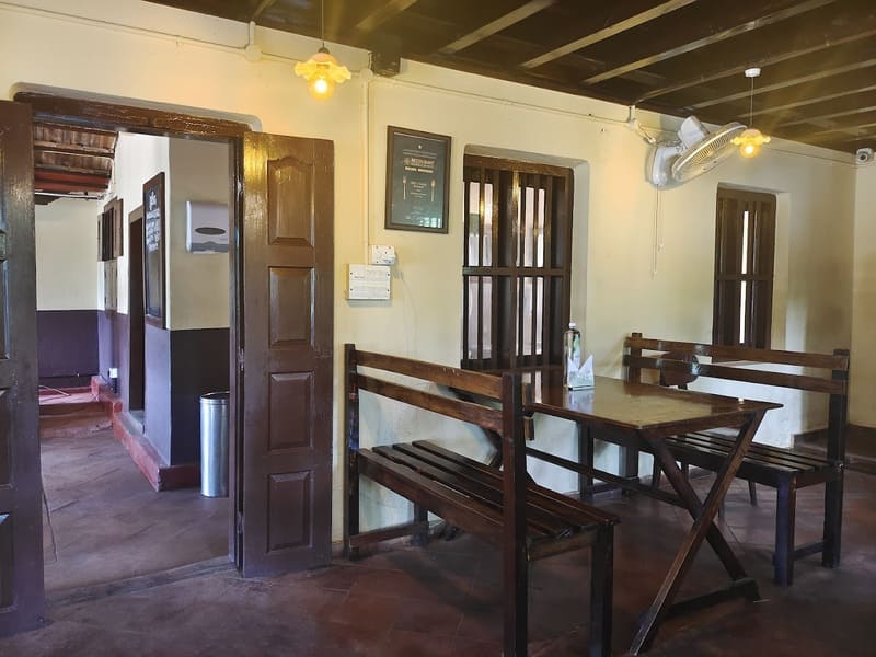 Interior of an old Indian restaurant, having wooden furniture and doors