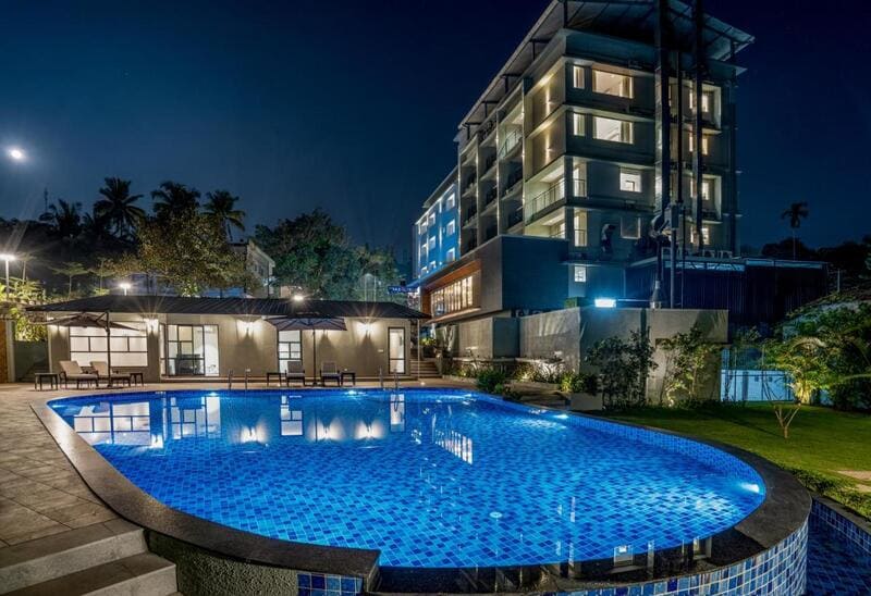 Hotel building exterior along with a swimming pool