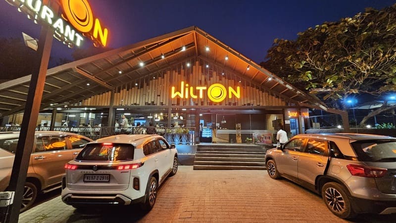 Mid class restaurant exterior with sign board